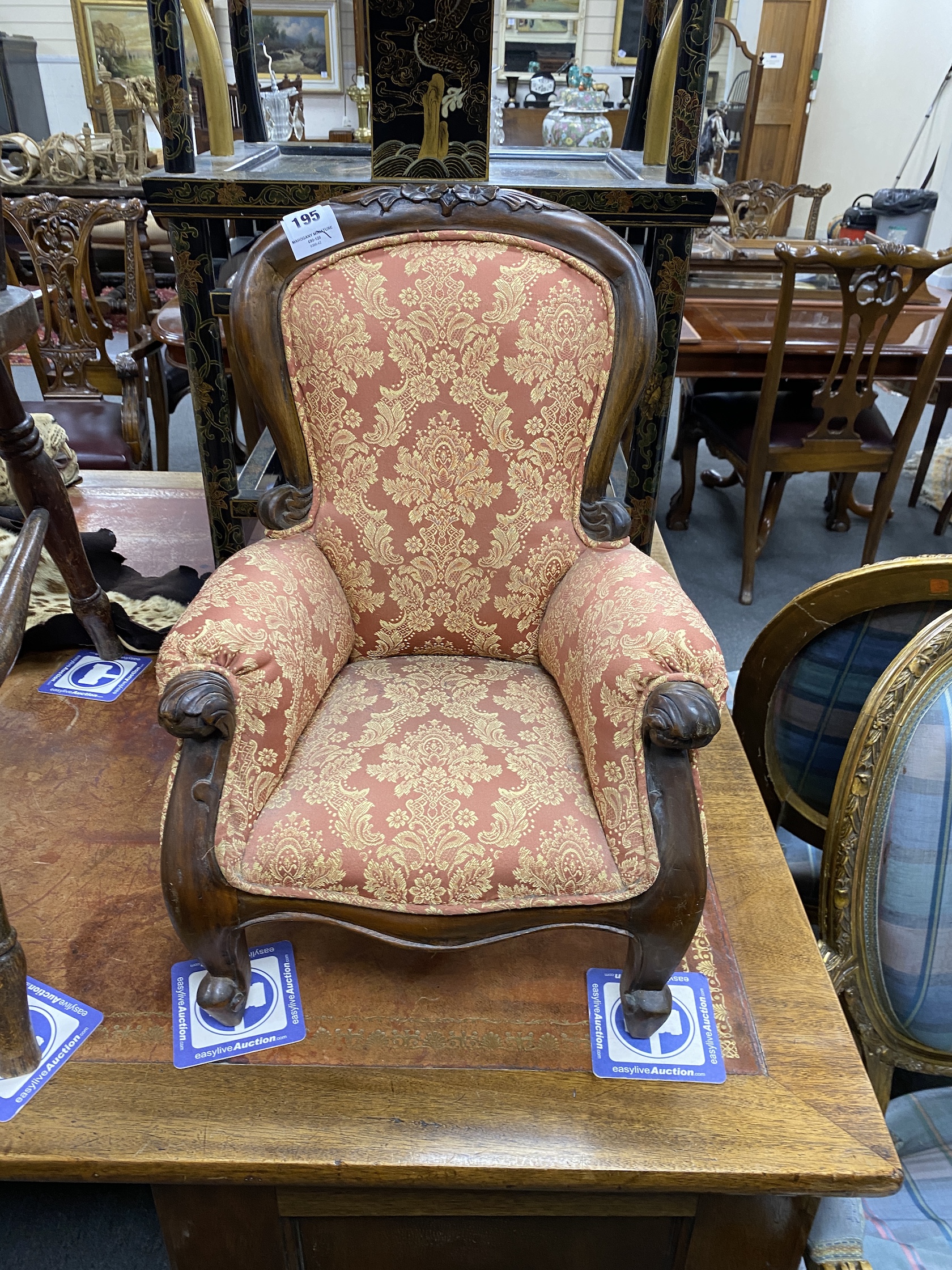 A Victorian style mahogany miniature upholstered elbow armchair, height 52cm